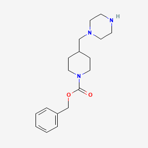 molecular formula C18H27N3O2 B13686281 1-[(1-Cbz-4-piperidyl)methyl]piperazine 