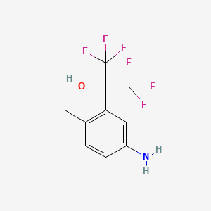 molecular formula C10H9F6NO B13687131 2-(5-Amino-2-methylphenyl)-1,1,1,3,3,3-hexafluoro-2-propanol 