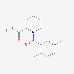 molecular formula C15H19NO3 B1369839 1-(2,5-Dimethylbenzoyl)piperidine-2-carboxylic acid 