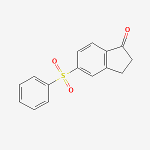 molecular formula C15H12O3S B1369951 5-Benzenesulfonylindan-1-one 