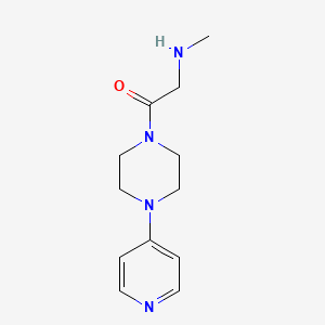 molecular formula C12H18N4O B1370410 2-(Methylamino)-1-(4-(pyridin-4-yl)piperazin-1-yl)ethan-1-one 