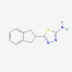 molecular formula C11H11N3S B13706654 2-Amino-5-(2-indanyl)-1,3,4-thiadiazole 