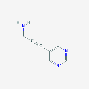 molecular formula C7H7N3 B1370729 3-Pyrimidin-5-ylprop-2-yn-1-amine 