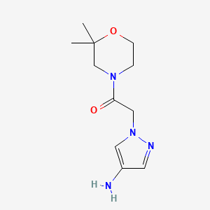 molecular formula C11H18N4O2 B1371143 2-(4-氨基-1H-吡唑-1-基)-1-(2,2-二甲基吗啉-4-基)乙烷-1-酮 CAS No. 1154969-57-9
