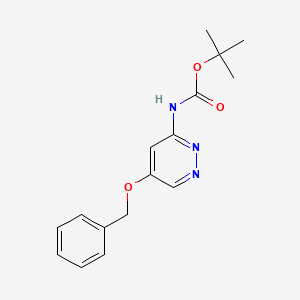 molecular formula C16H19N3O3 B13718527 N-Boc-5-(benzyloxy)-3-pyridazinamine 
