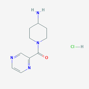 molecular formula C10H15ClN4O B1371960 (4-Amino-piperidin-1-yl)-pyrazin-2-yl-methanone hydrochloride CAS No. 1185308-94-4