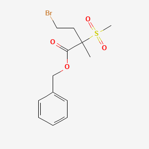 molecular formula C13H17BrO4S B13721708 Benzyl 4-bromo-2-methyl-2-(methylsulfonyl)butanoate 