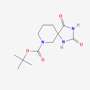 molecular formula C12H19N3O4 B1372725 tert-Butyl 2,4-dioxo-1,3,7-triazaspiro[4.5]decane-7-carboxylate CAS No. 887120-96-9