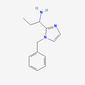 molecular formula C13H17N3 B1374142 1-(1-benzyl-1H-imidazol-2-yl)propan-1-amine CAS No. 1354959-63-9