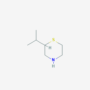 molecular formula C7H15NS B1374443 2-(Propan-2-yl)thiomorpholine CAS No. 1354949-45-3