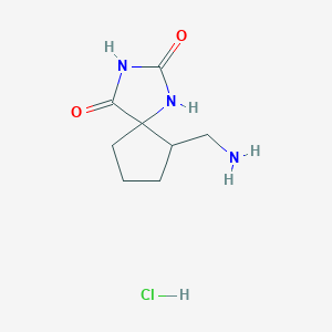 molecular formula C8H14ClN3O2 B1374468 6-(Aminomethyl)-1,3-diazaspiro[4.4]nonane-2,4-dione hydrochloride CAS No. 1354961-90-2