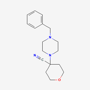 4-(4-Benzylpiperazin-1-yl)oxane-4-carbonitrile
