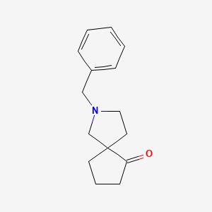 molecular formula C15H19NO B1375755 2-苄基-2-氮杂螺[4.4]壬烷-6-酮 CAS No. 160746-93-0