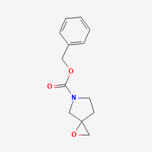 molecular formula C13H15NO3 B1376035 苯甲酸苄酯 1-氧杂-5-氮杂螺[2.4]庚烷-5-甲酸酯 CAS No. 790704-73-3