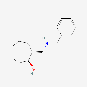 molecular formula C15H23NO B13771077 (1S,2S)-2-[(benzylamino)methyl]cycloheptan-1-ol 