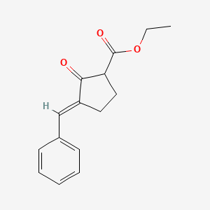 molecular formula C15H16O3 B13773708 3-Benzylidene-2-oxo-cyclopentanecarboxylic acid ethyl ester 