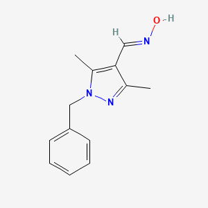 molecular formula C13H15N3O B1377740 N-[(1-benzyl-3,5-dimethyl-1H-pyrazol-4-yl)methylidene]hydroxylamine CAS No. 1375476-93-9
