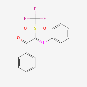 molecular formula C15H10F3IO3S B1377792 Benzoyl(phenyliodonio)(trifluoromethanesulfonyl)methanide CAS No. 1443036-49-4