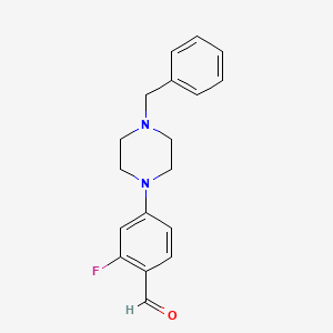 molecular formula C18H19FN2O B13778410 4-(4-Benzyl-1-piperazino)-2-fluoro-benzaldehyde 