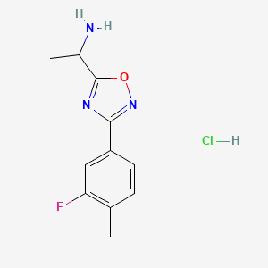 molecular formula C11H13ClFN3O B1378127 1-[3-(3-Fluoro-4-methylphenyl)-1,2,4-oxadiazol-5-yl]ethan-1-amine hydrochloride CAS No. 1394041-49-6
