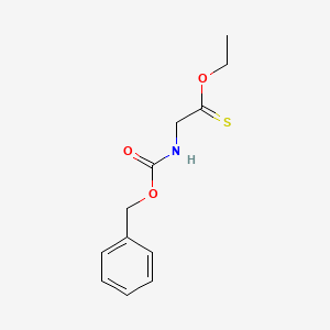 molecular formula C12H15NO3S B13782114 O-Ethyl {[(benzyloxy)carbonyl]amino}ethanethioate CAS No. 91641-80-4