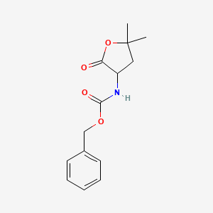 molecular formula C14H17NO4 B1378352 苯甲酸N-(5,5-二甲基-2-氧代氧杂环-3-基)氨基甲酸酯 CAS No. 30239-01-1