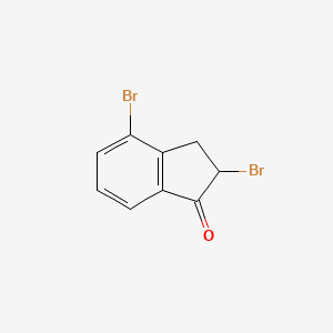 molecular formula C9H6Br2O B13786566 2,4-Dibromo-2,3-dihydro-1H-inden-1-one CAS No. 25834-53-1