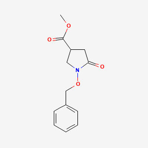 molecular formula C13H15NO4 B1378767 Methyl 1-(benzyloxy)-5-oxopyrrolidine-3-carboxylate CAS No. 1461706-59-1