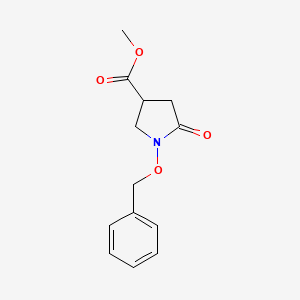 molecular formula C13H15NO4 B1378767 1-(Benzyloxy)-5-oxopyrrolidine-3-carboxylic acid methyl ester CAS No. 1461706-59-1
