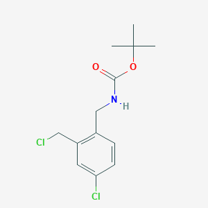 molecular formula C13H17Cl2NO2 B1378908 Tert-butyl 4-chloro-2-(chloromethyl)benzylcarbamate CAS No. 928754-18-1