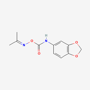 molecular formula C11H12N2O4 B13790351 Acetone, O-((1,3-benzodioxol-5-YL)carbamoyl)oxime CAS No. 97805-01-1