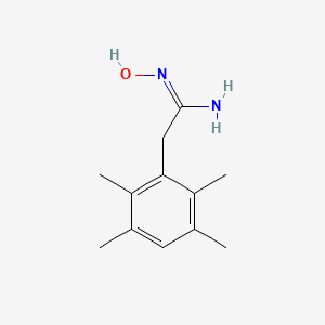 molecular formula C12H18N2O B13792339 N-Hydroxy-2-(2,3,5,6-tetramethyl-phenyl)-acetamidine CAS No. 885952-86-3
