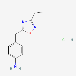 molecular formula C11H14ClN3O B1379322 4-[(3-Ethyl-1,2,4-oxadiazol-5-yl)methyl]aniline hydrochloride CAS No. 1461704-77-7