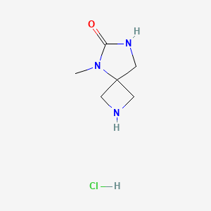 molecular formula C6H12ClN3O B1379741 5-Methyl-2,5,7-triazaspiro[3.4]octan-6-one hydrochloride CAS No. 1609403-10-2