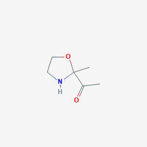 molecular formula C6H11NO2 B137983 1-(2-Methyloxazolidin-2-yl)ethanone CAS No. 130028-27-2