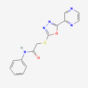 molecular formula C14H11N5O2S B13798737 N-Phenyl-2-{[5-(2-pyrazinyl)-1,3,4-oxadiazol-2-yl]sulfanyl}acetamide 