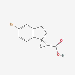 5'-Bromo-2',3'-dihydrospiro[cyclopropane-1,1'-indene]-3-carboxylic acid