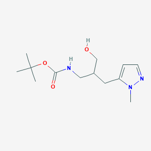 molecular formula C13H23N3O3 B1382144 tert-butyl N-{3-hydroxy-2-[(1-methyl-1H-pyrazol-5-yl)methyl]propyl}carbamate CAS No. 1803607-33-1