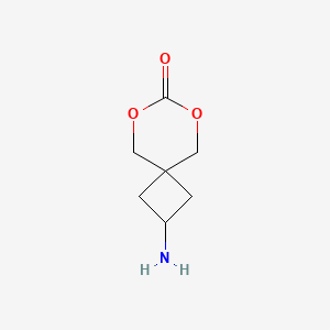 molecular formula C7H11NO3 B1382686 2-Amino-6,8-dioxaspiro[3.5]nonan-7-one CAS No. 2060027-56-5