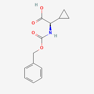 molecular formula C13H15NO4 B1382989 (R)-Benzyloxycarbonylamino-cyclopropyl-acetic acid CAS No. 1260593-73-4