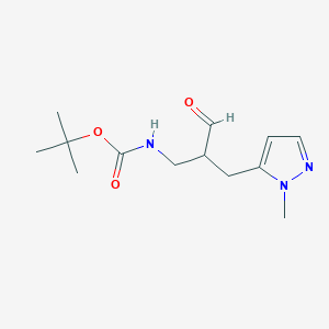 molecular formula C13H21N3O3 B1382999 tert-butyl N-{2-[(1-methyl-1H-pyrazol-5-yl)methyl]-3-oxopropyl}carbamate CAS No. 1803588-72-8