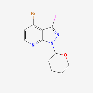 molecular formula C11H11BrIN3O B1383077 4-Bromo-3-iodo-1-(tetrahydro-2H-pyran-2-yl)-1H-pyrazolo[3,4-b]pyridine CAS No. 1416712-50-9