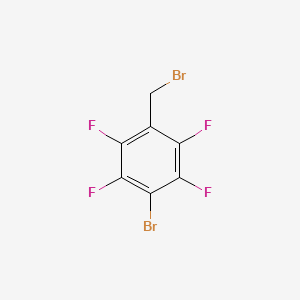 molecular formula C7H2Br2F4 B1383108 1-Bromo-4-(bromomethyl)-2,3,5,6-tetrafluorobenzene CAS No. 1049037-64-0