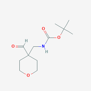 molecular formula C12H21NO4 B1383292 tert-butyl N-[(4-formyloxan-4-yl)methyl]carbamate CAS No. 1803590-87-5