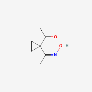 molecular formula C7H11NO2 B13834502 Ethanone,1-(1-acetylcyclopropyl)-,1-oxime(9ci) 