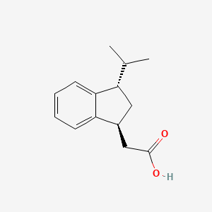 molecular formula C14H18O2 B1383477 2-[(1S,3S)-3-(propan-2-yl)-2,3-dihydro-1H-inden-1-yl]acetic acid CAS No. 1808353-81-2