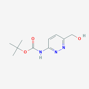 molecular formula C10H15N3O3 B1383654 tert-butyl N-[6-(hydroxymethyl)pyridazin-3-yl]carbamate CAS No. 2059955-88-1