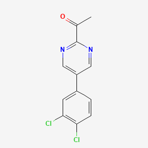 molecular formula C12H8Cl2N2O B13853450 1-[5-(3,4-Dichlorophenyl)pyrimidin-2-yl]ethanone 