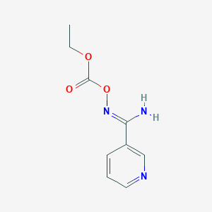 molecular formula C9H11N3O3 B1386807 N'-[(Ethoxycarbonyl)oxy]pyridine-3-carboximidamide CAS No. 1173512-98-5