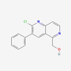 molecular formula C15H11ClN2O B13882541 (2-Chloro-3-phenyl-1,6-naphthyridin-5-yl)methanol 